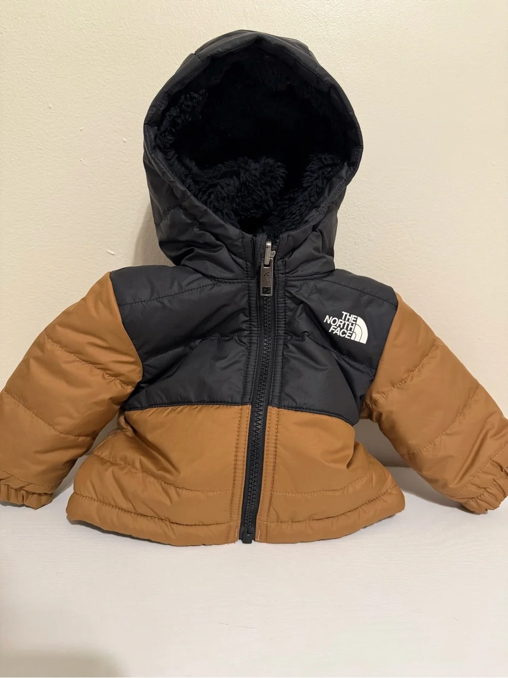 The North Face baby Two-Tone Black and Brown Puffer Jacket with Hood